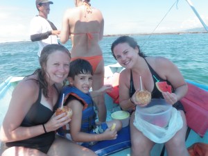 Us and Andres enjoying our fresh coconut on the boat